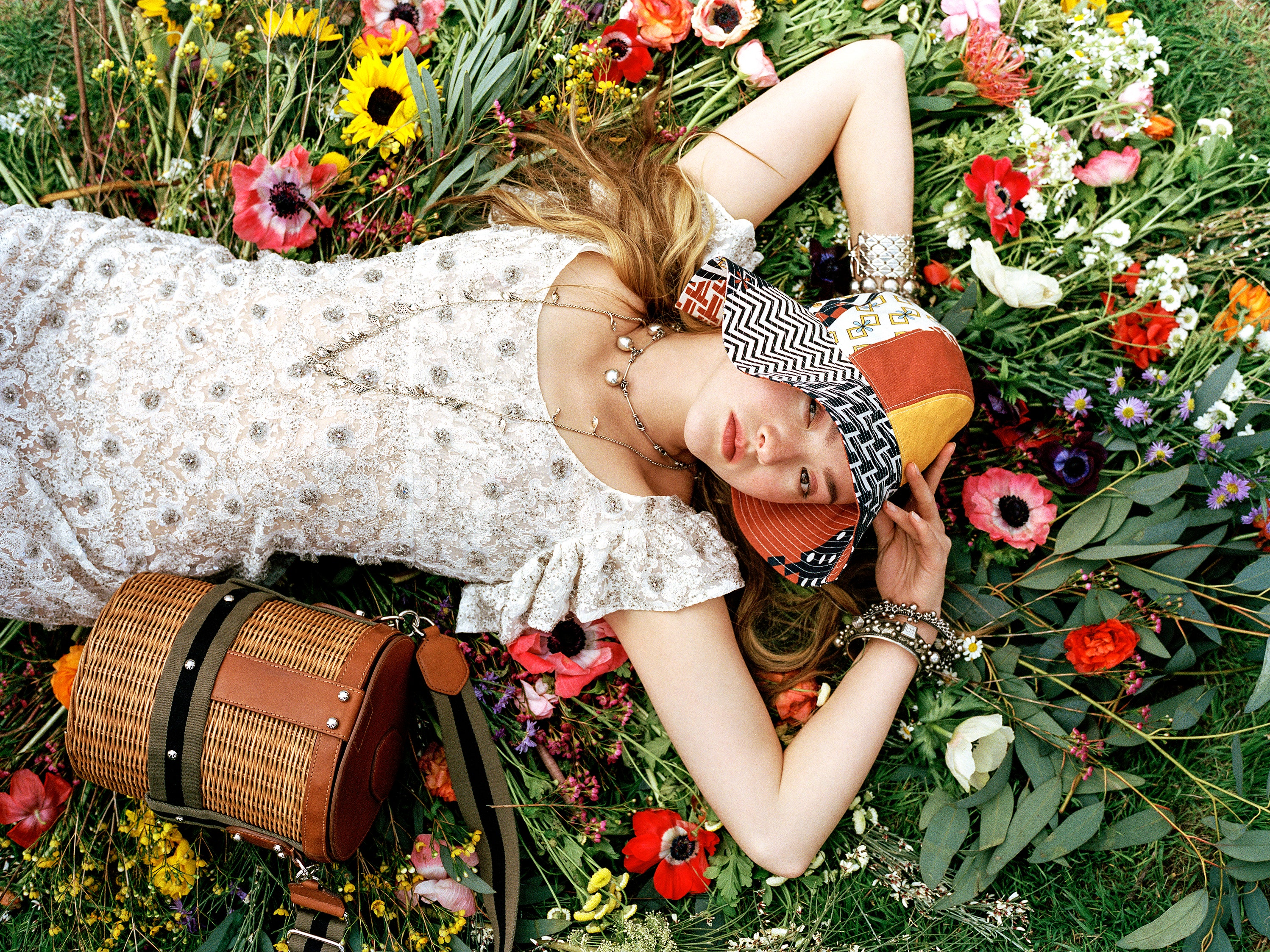 Image may contain Plant Human Person Flower Blossom Flower Arrangement and Flower Bouquet