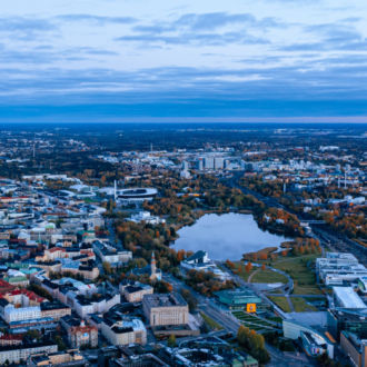 A city and several bays are visible in an aerial photo.