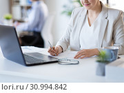 businesswoman with papers working at office. Стоковое фото, фотограф Syda Productions / Фотобанк Лори