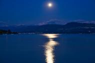 Full Moon reflecting in a lake. 