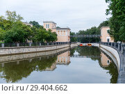 Yauza river with two sluices of Syromyatnicheskiy waterworks against the cityscape in Moscow. Стоковое фото, фотограф Mikhail Starodubov / Фотобанк Лори