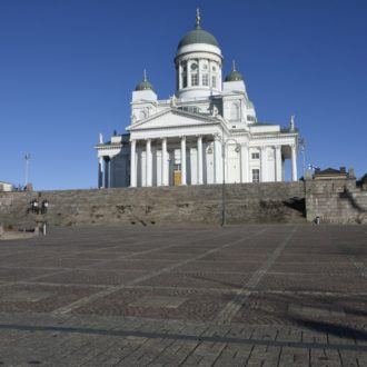 Helsinki’s Lutheran Cathedral is in the background overlooking an empty Senate Square in the spring of 2020.