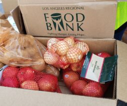 Onions, apples and potatoes are at a drive-through distribution hosted by the LA Regional Food Bank.