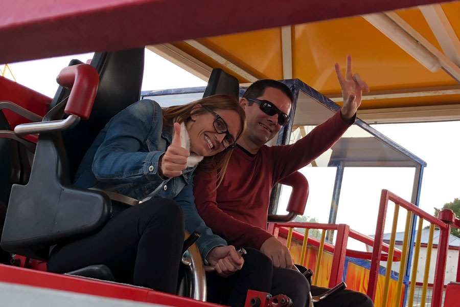 A man and a woman on a roller coaster