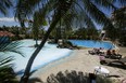 Tourists sunbathe near a pool in a hotel, as Costa Rica tourism industry braces for coronavirus disease (COVID-19) outbreak, in Heredia, Costa Rica March 18, 2020.