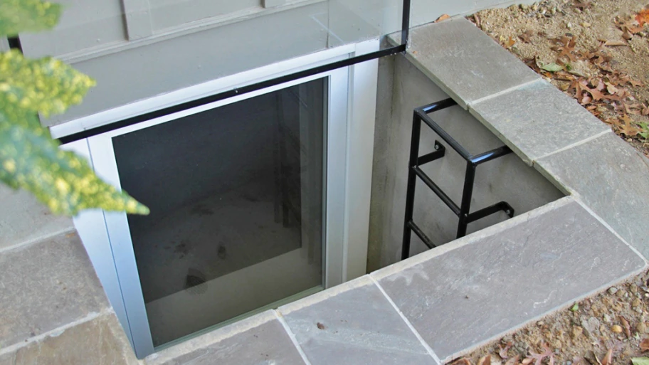 egress window with well and ladder and stone surround