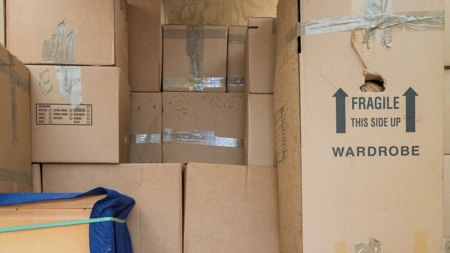 moving boxes stacked in truck (Photo by Eldon Lindsay)