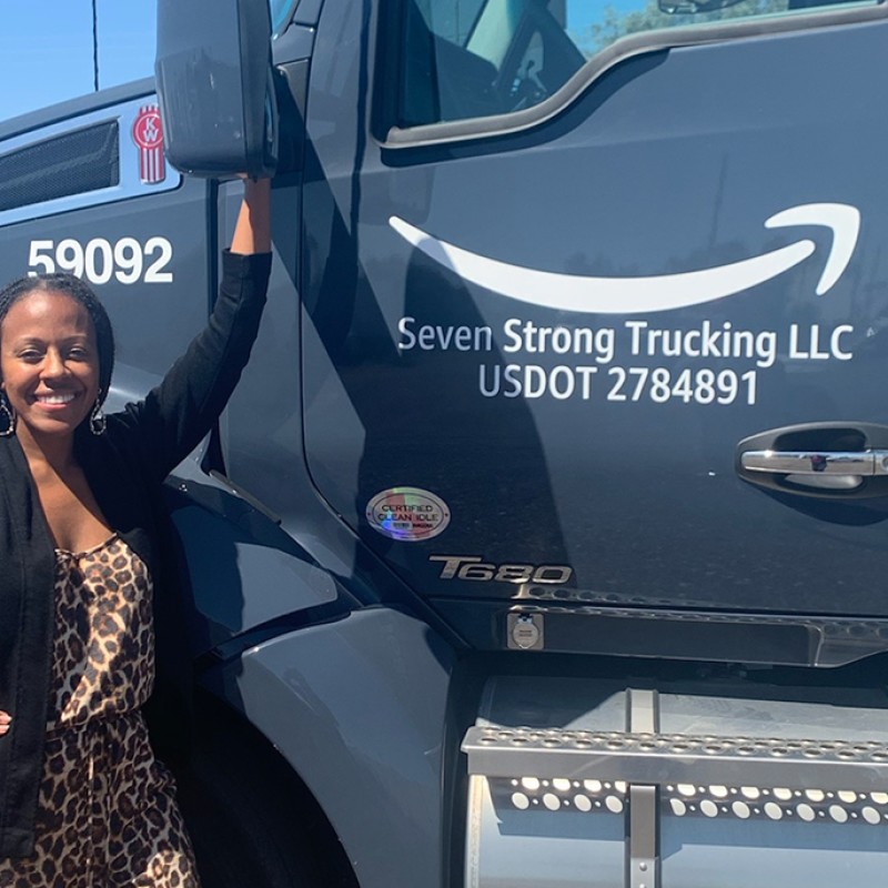 An image of a Black woman who is leading a company that supports Amazon's middle and last mile logistics operations. 