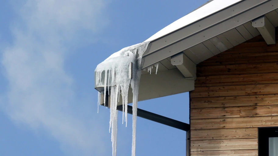 cluster of icicles hanging on gutter