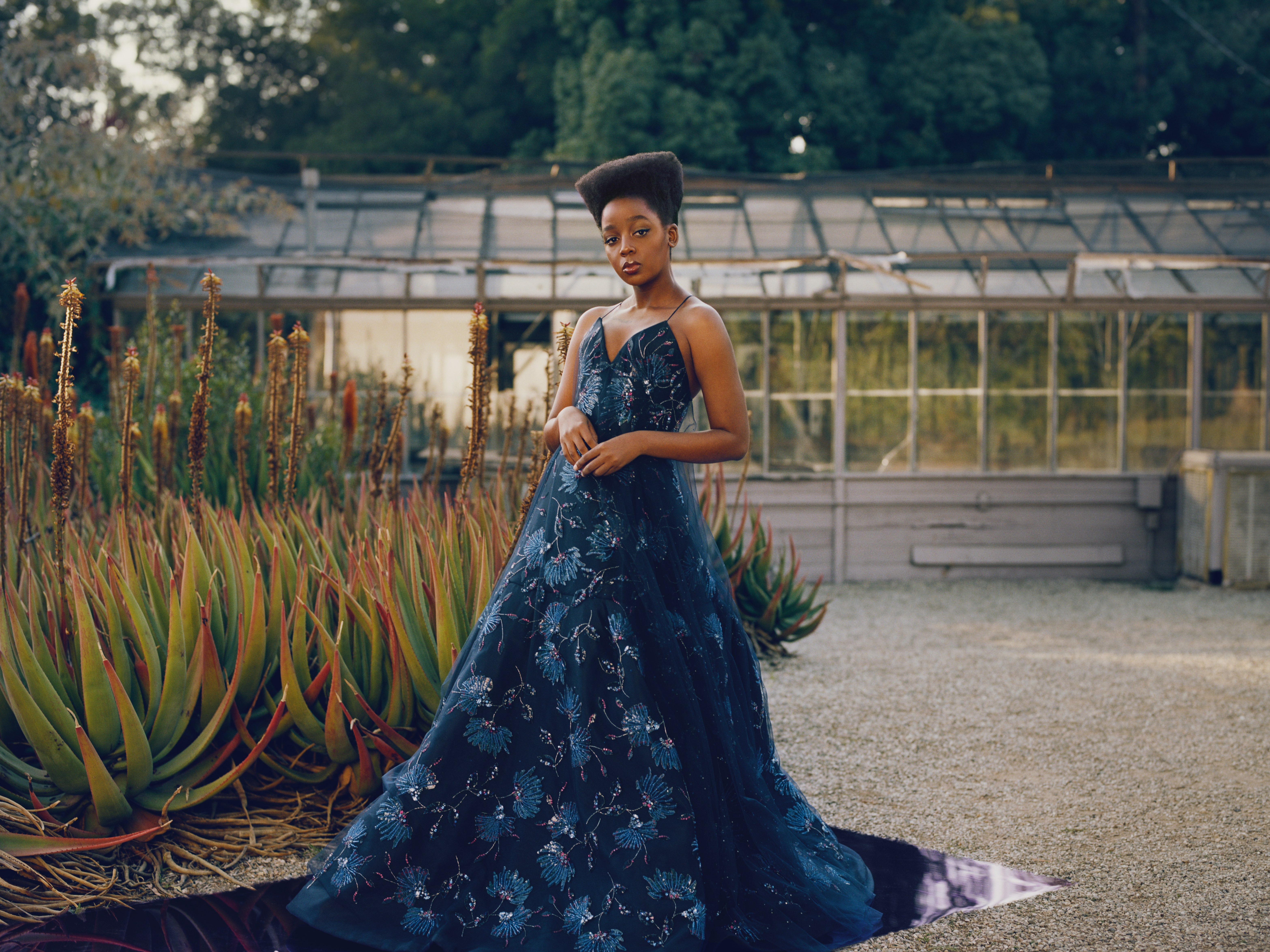 Mbedu wears an Armani Priv dress. Hair Nikki Nelms makeup Raisa Flowers. Fashion Editor Tonne Goodman.