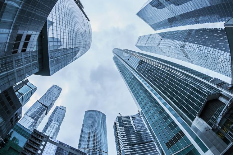 Modern glass silhouettes of skyscrapers in the city.