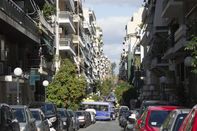 Europe, Greece, Athens, Piraeus Area, 2018: View Of Road And Apartment Buildings