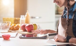 Smiling woman using tablet