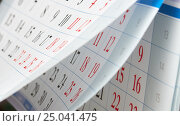 Flipping of calendar sheets with black and red numbers. Стоковое фото, фотограф Сергей Федулов / Фотобанк Лори