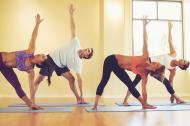 Group of people doing yoga.