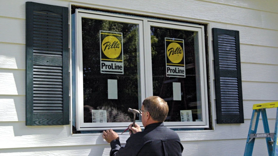 window, man installing window