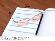 Notebook, pencil, glasses. Стоковое фото, фотограф Евгений Ткачёв / Фотобанк Лори