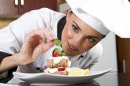 Female chef creating a desert.