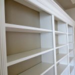 white built-in bookshelves