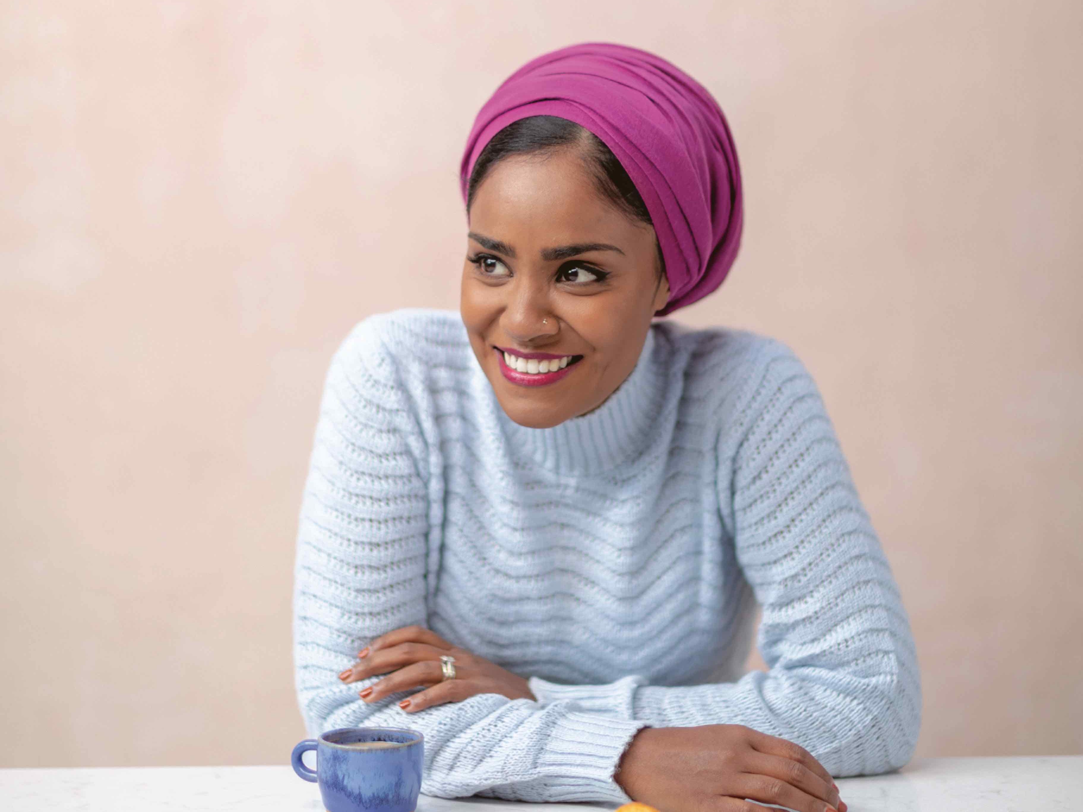 Image may contain Nadiya Hussain Clothing Apparel Human Person Sleeve Face Headband Hat and Turban