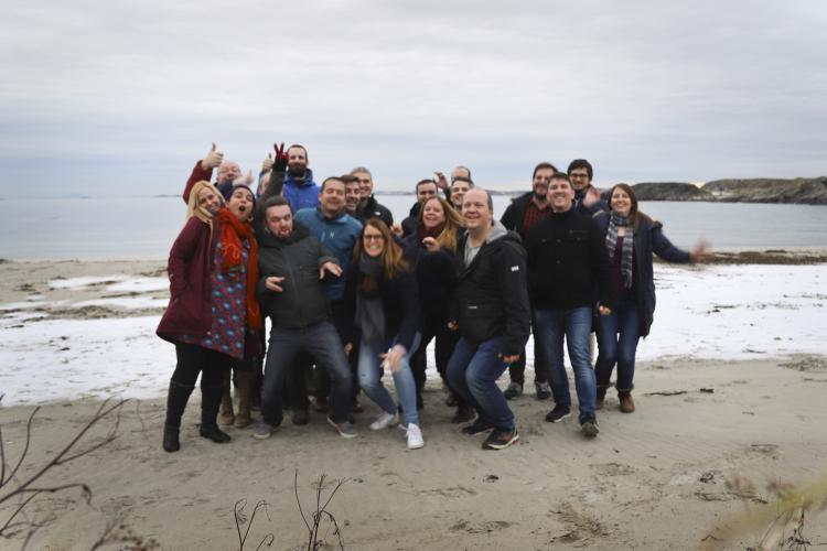 Picture of the timeanddate staff on a beach.