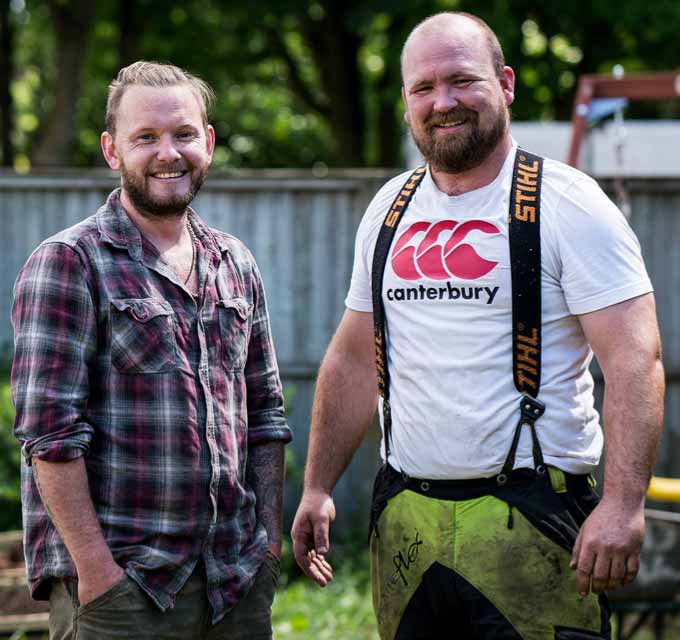 Tree surgeons paused at work to smile at the camera