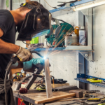 Man welding in his shop