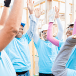 Construction crew volunteering to build a house