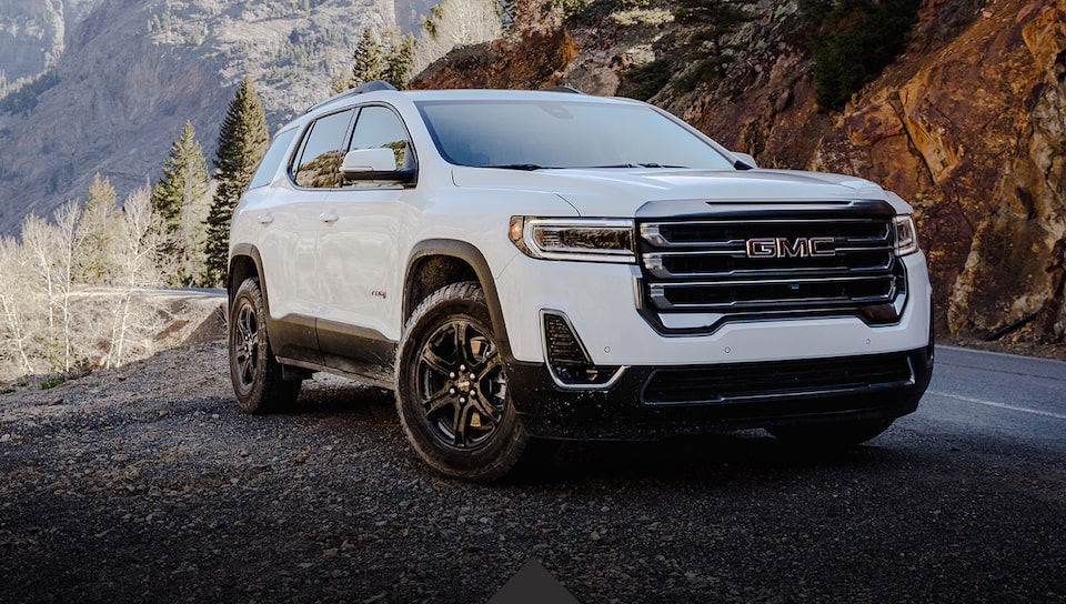 2021 GMC Acadia Denali Mid-Size Luxury SUV front angle exterior view driving on road