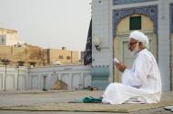 Man Reading Quran