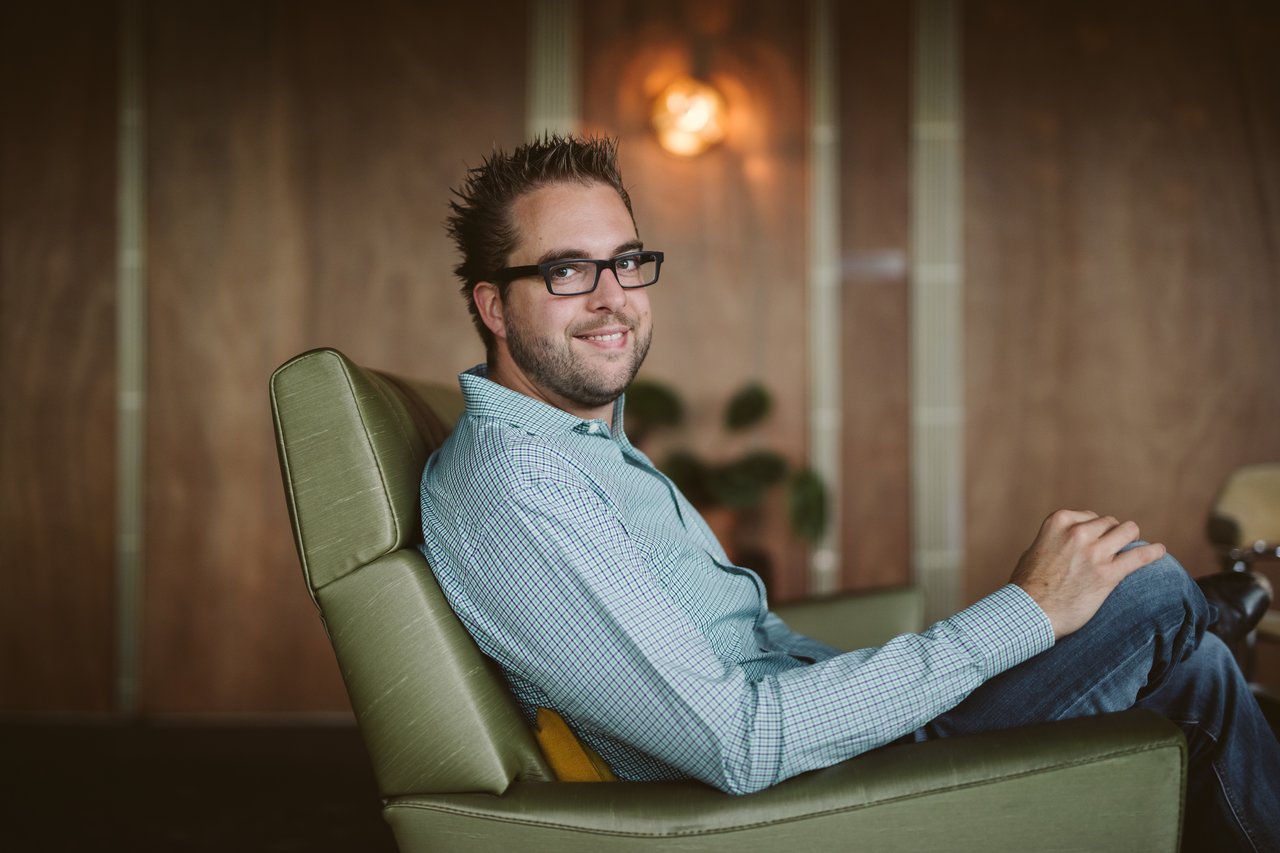 Dries sitting on a sofa, looking sideways