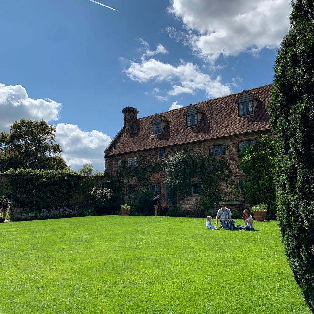 A family having a picnic at Sissinghurst gardens