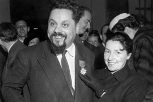 Dr. Alain Bombard with his wife at the Naval Museum in Paris, France, Feb. 15, 1957, after being presented with the Cross and Red Ribbon of the 'Legion of Honour', by Roger Duveau, the French Minister for the merchant navy. The award was made to Bombard for his crossing of the Atlantic Ocean in a rubber dinghy in December 1952. (AP Photo)