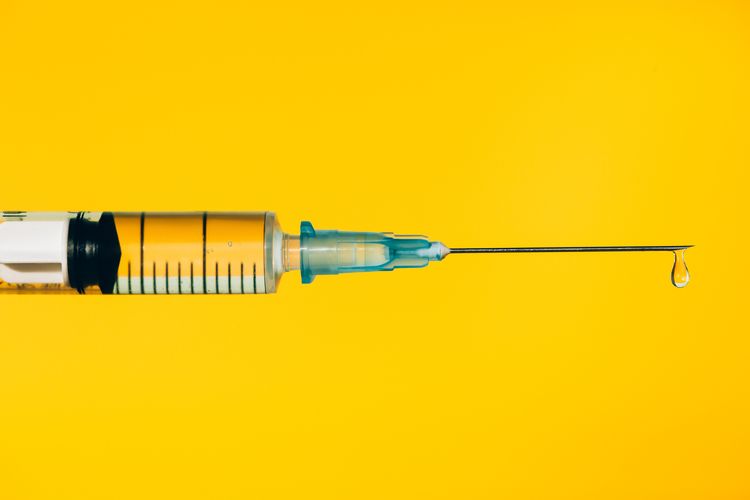 Modern syringe with liquid drug. The most anticipated procedure of the year