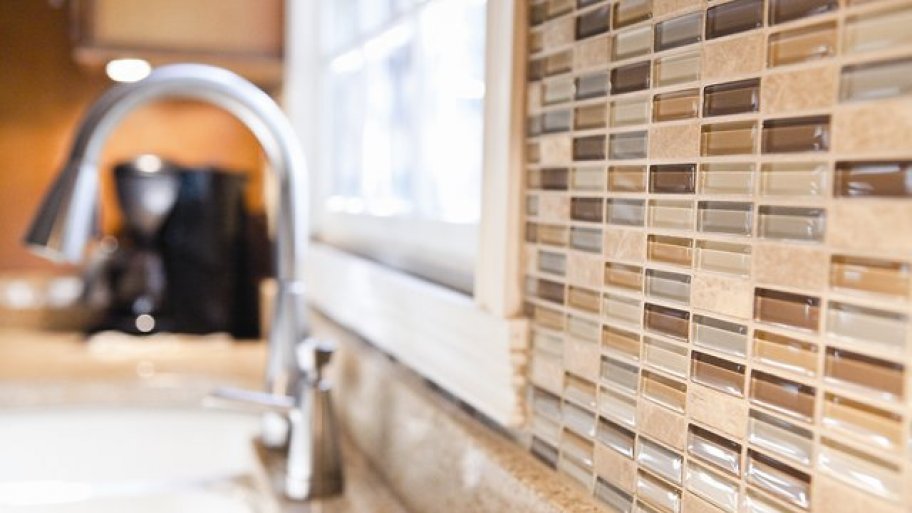 glass and natural stone tiles for a kitchen backsplash