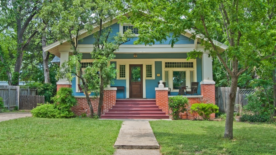 craftsman bungalow house with blue paint job