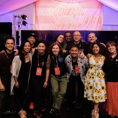 Support team standing together in a group waving