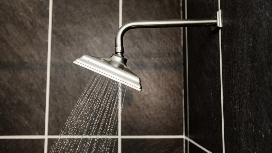 new square shower head spraying water