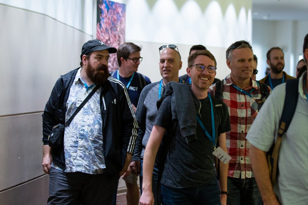 Attendees walking down the hall