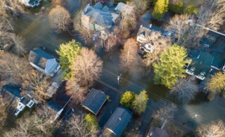 Luxury homes flooded as the river swells into historic neighborhood