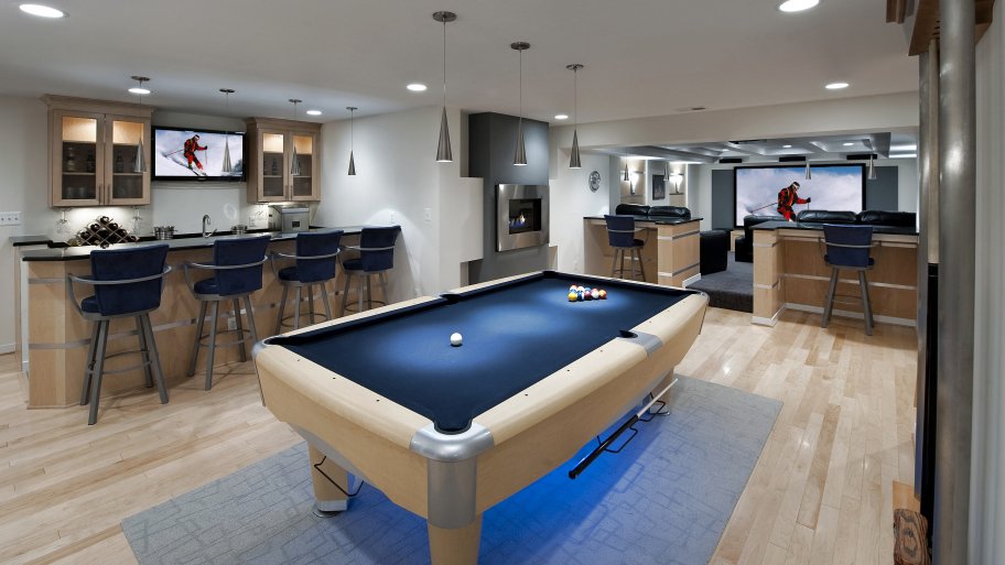 finished basement with pool table and wet bar