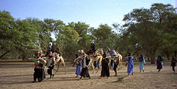 1997 277-2A Wodaabe leaving camp.jpg