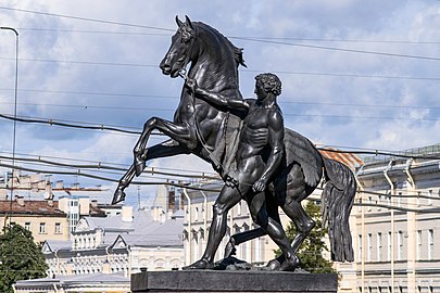 The Horse Tamers, on the on the Anichkov Bridge, designed by the Russian sculptor, Baron Peter Klodt von Jurgensburg. The silhouettes of the sculptural groups on high pedestals are so expressive that they ensured incredible success for this monument. (photo)