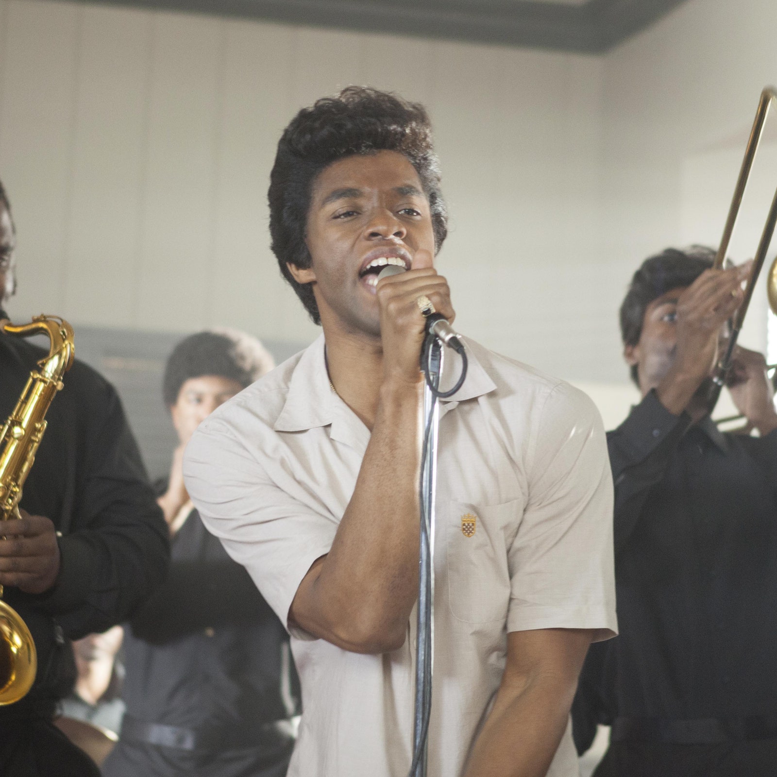 Image may contain James Brown Chadwick Boseman Human Person Musical Instrument Brass Section Horn Leisure Activities and...