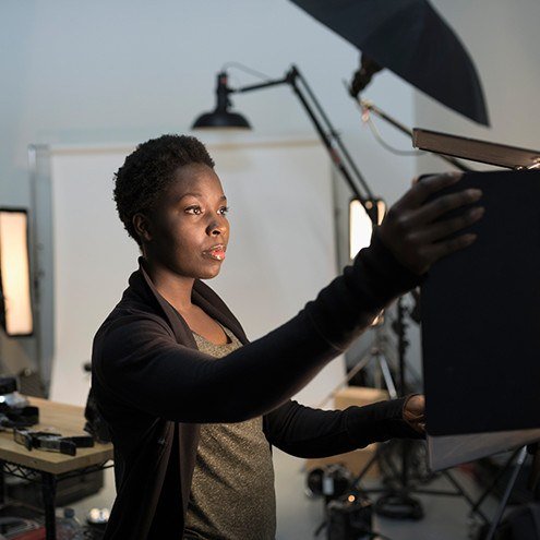 Small business owner setting up her studio