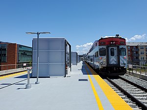 Southbound train leaving Hillsdale station, May 2021.jpg