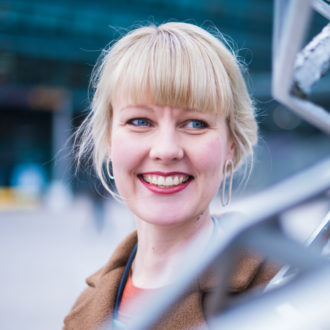 Portrait of Meeri Haataja, smiling widely.