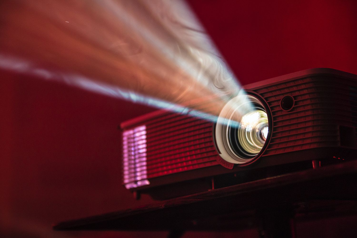 Projector with light cone coming from lens.