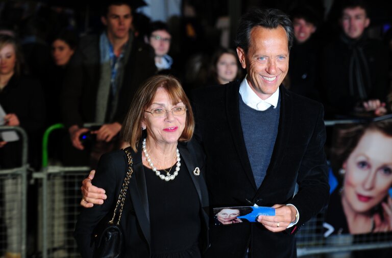 Joan Washington in 2012 with her husband, Richard E. Grant. He was one of the many actors Ms. Washington trained to speak in accents from all over the world.