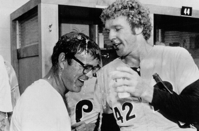 Ruly Carpenter, the owner of the Philadelphia Phillies, received a champagne bath from the pitcher Ron Reed after the team defeated the Pittsburgh Pirates to clinch the National League East title in 1978. The Phillies won the division three times before finally winning the pennant, and the World Series, in 1980.